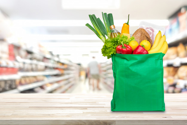 shopping bag with food and groceries on the table in supermarket 8087 1414