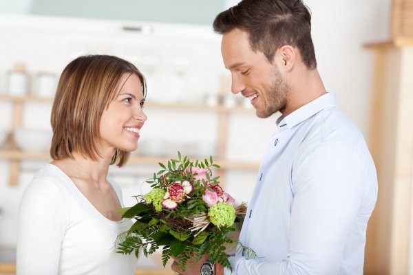 depositphotos 26806409 stock photo young man gives flowers to