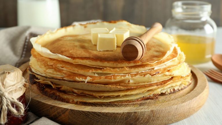 concept of tasty food with crepes close up 1200x675