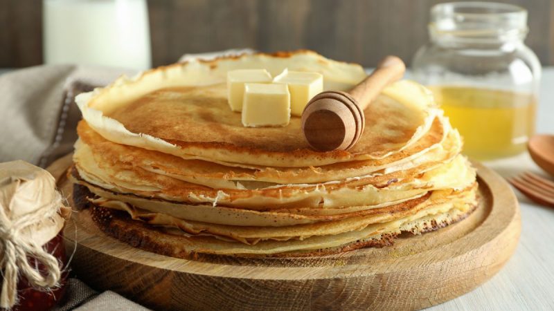 concept of tasty food with crepes close up 1200x675 scaled