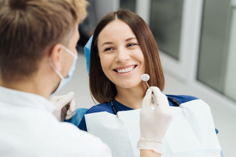 Вініри: від першої консультації до результату 8 male professional dentist with gloves mask discuss what treatment will look like patient s teeth